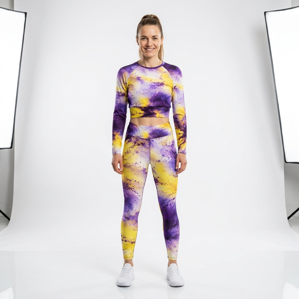 Model wearing a matching Sorbet Midnight Glow activewear set, standing in a studio.