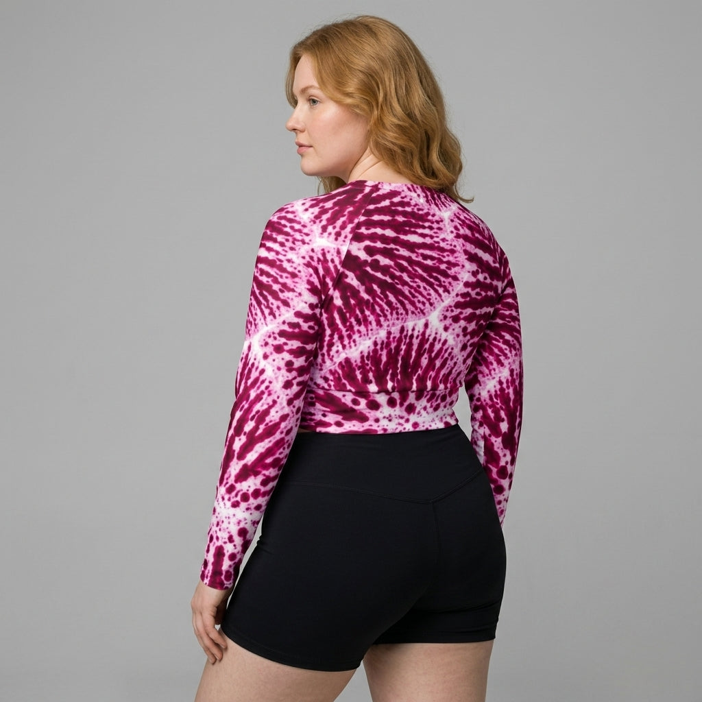 Fitness model wearing Phalaenopsis Orchid (ivory and magenta) long-sleeve crop top.