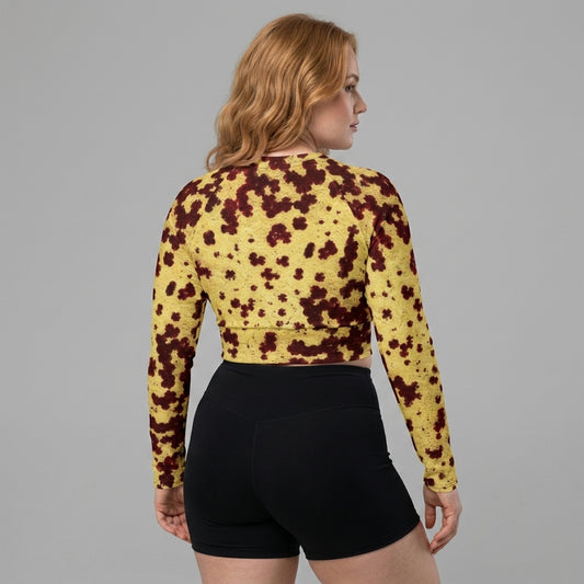 Model wearing Godefroyae Orchid (cream and burgundy) long-sleeve crop top.