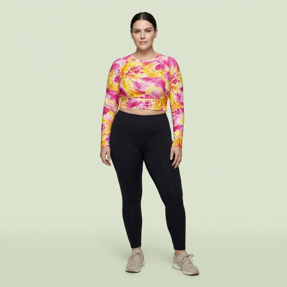 Model wearing Labyrinth Dahlia print long-sleeve crop top in a studio setting