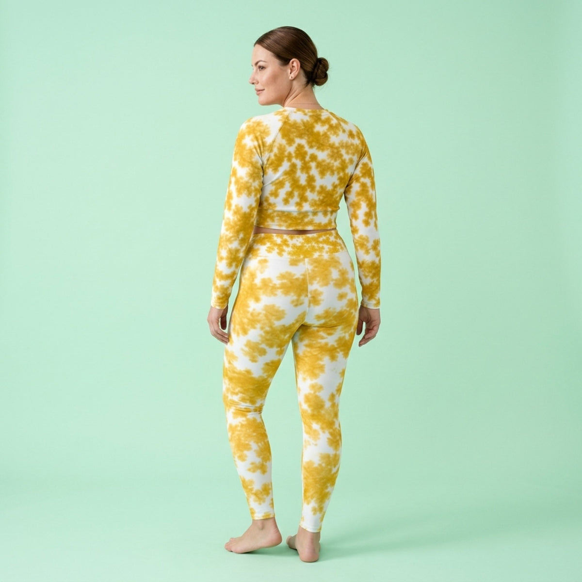 Model wearing the Rancho Bariloche Orchid set – yoga leggings and long sleeve crop top