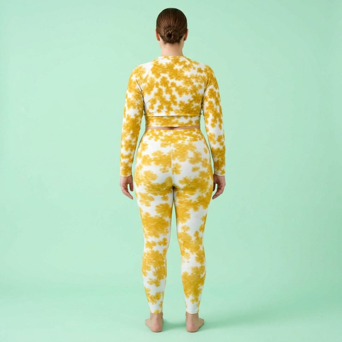 Model wearing the Rancho Bariloche Orchid set – yoga leggings and long sleeve crop top