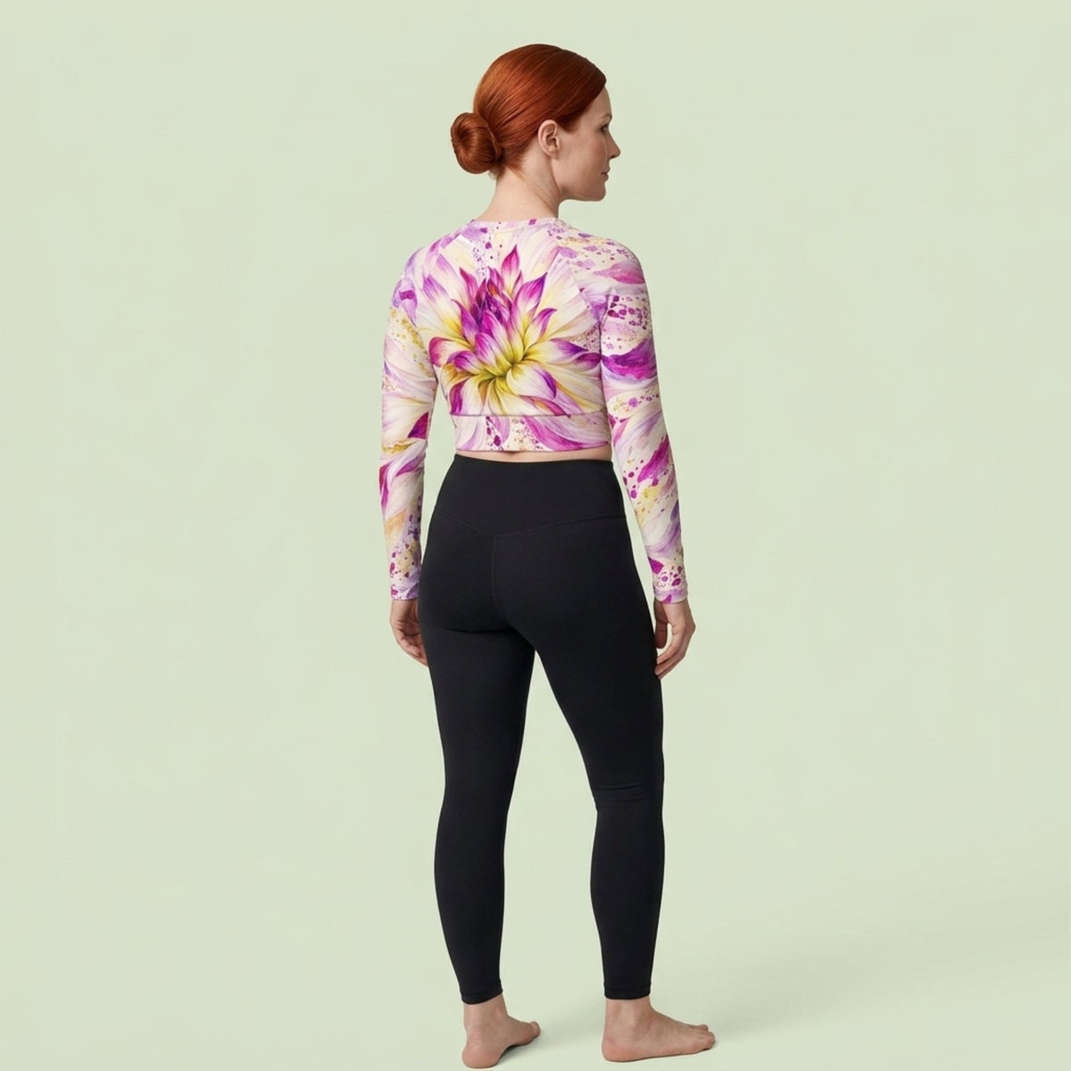 Model wearing the Bold Accent Dahlia Long Sleeve Crop Top in a studio