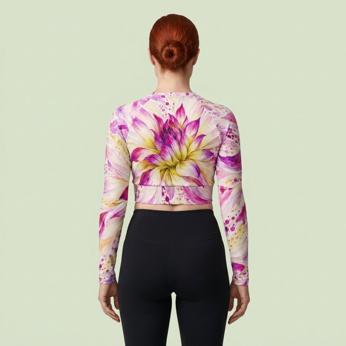 Model wearing the Bold Accent Dahlia Long Sleeve Crop Top in a studio
