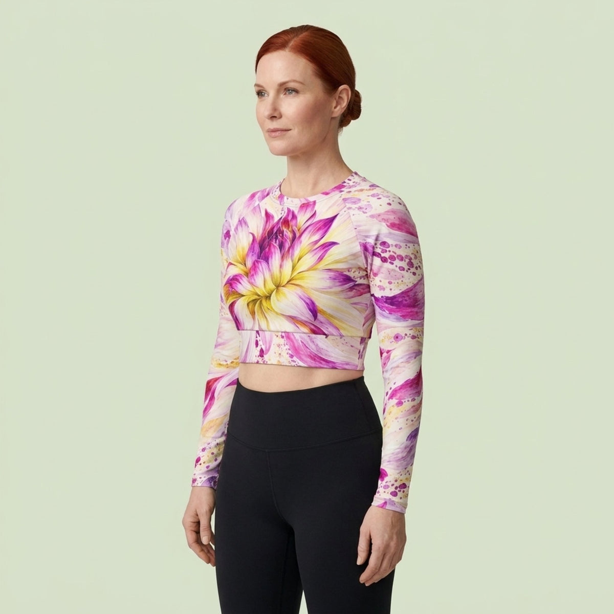 Model wearing the Bold Accent Dahlia Long Sleeve Crop Top in a studio