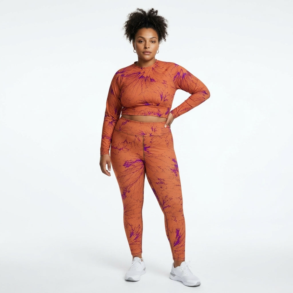 Model wearing a matching Admire Orange Purple Wing athletic set (view 2).