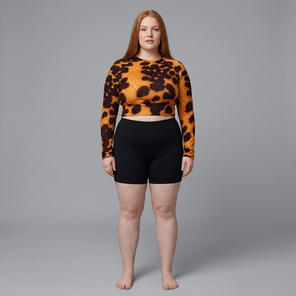 Model wearing Tiger Orchid (gold and burgundy) long-sleeve crop top (view 2).