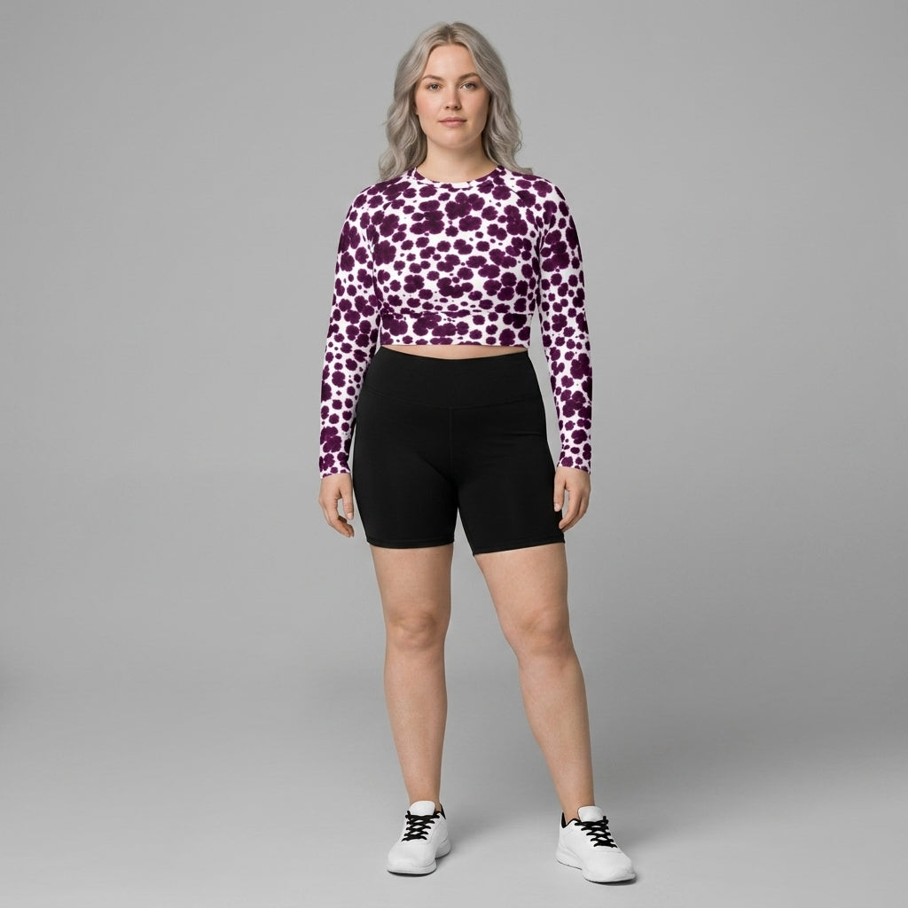 Plus-size model wearing Lioulin Wild Cat Orchid (burgundy and cream) long-sleeve crop top.
