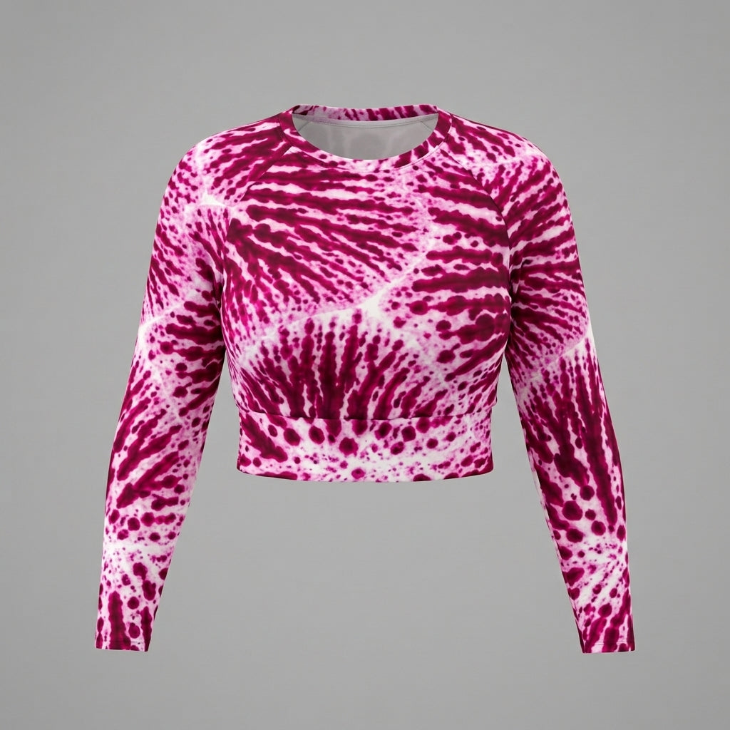 Long-sleeve crop top in the Phalaenopsis Orchid (ivory and magenta) print, studio product shot.