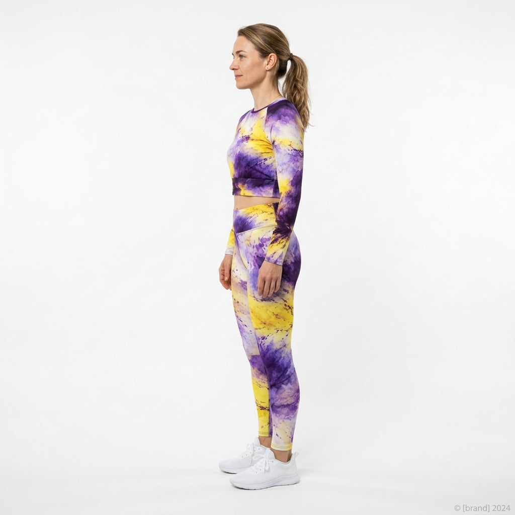 Model wearing a matching Sorbet Midnight Glow activewear set, standing in a white studio (view 2).
