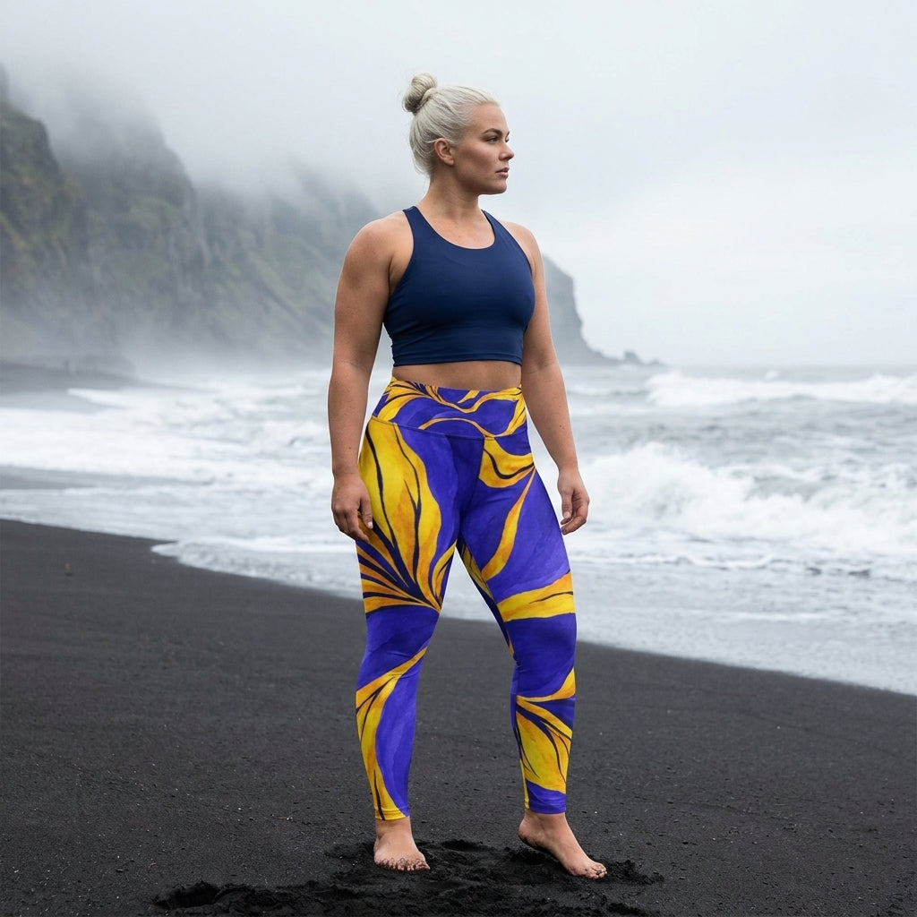 Woman wearing purple floral-print leggings on beach