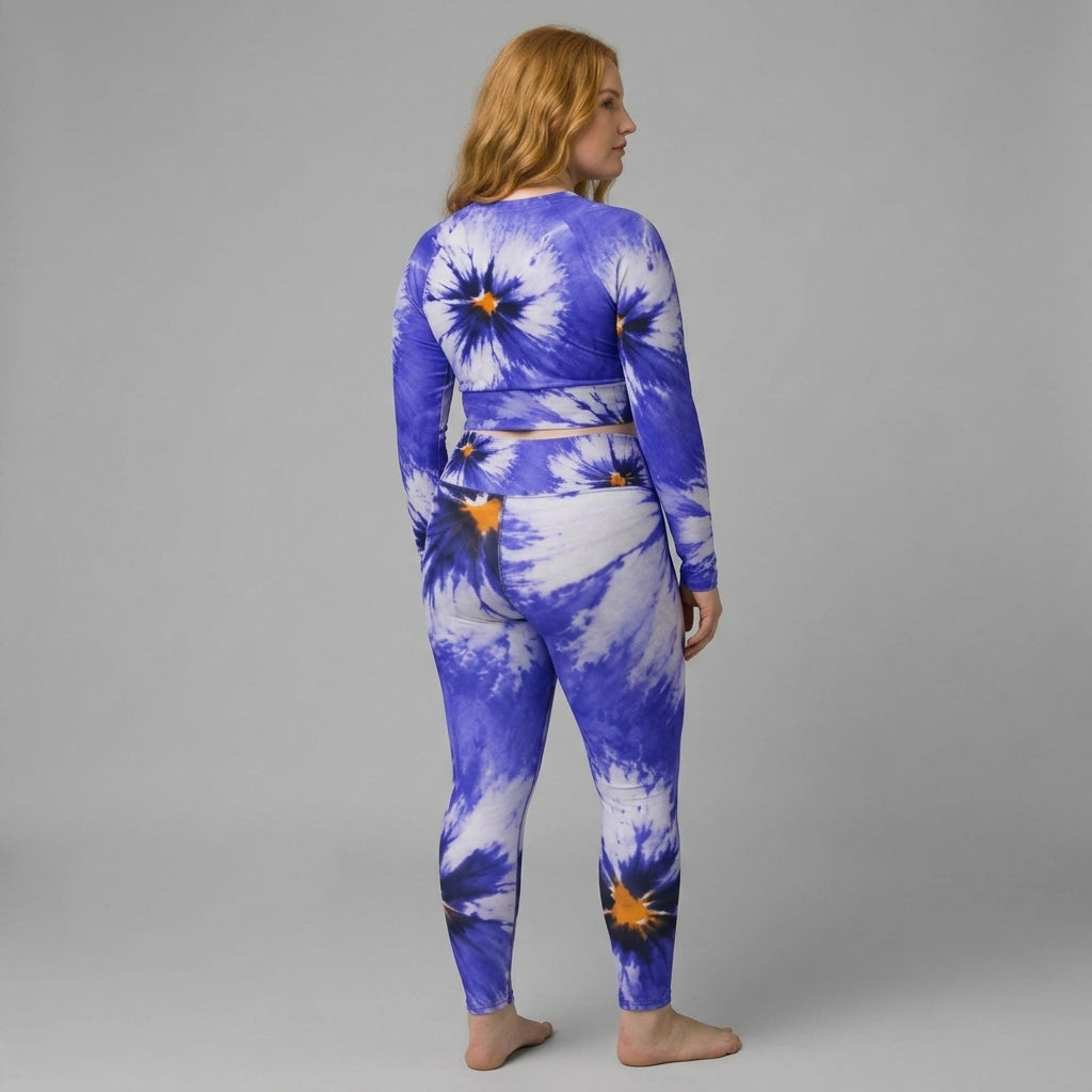 Model wearing a blue floral activewear set in the Sorbet Delft Blue print (view 2).