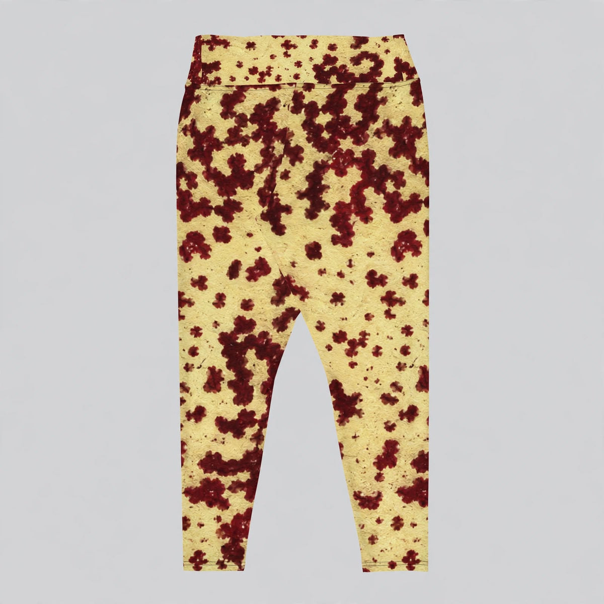 Plus size leggings in the Godefroyae Orchid (cream and burgundy) print, studio product shot against a grey background.