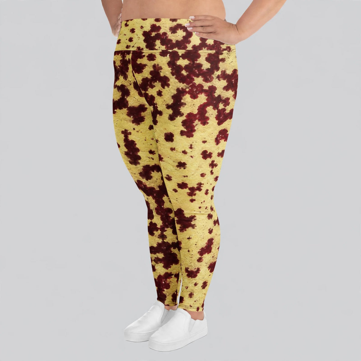 Plus size leggings in the Godefroyae Orchid (cream and burgundy) print, studio product shot.