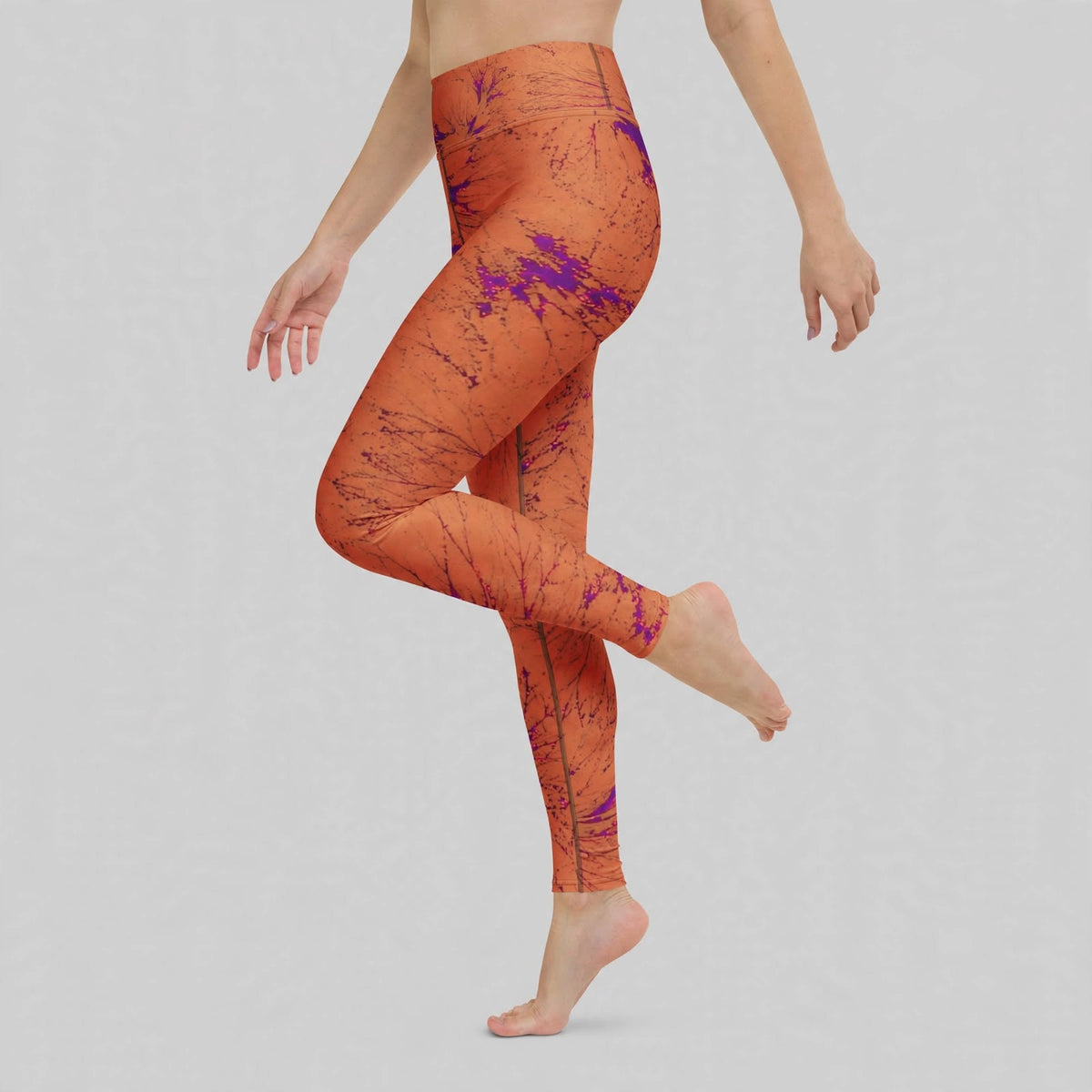 Leggings in the Admire Orange Purple Wing print, studio product shot.