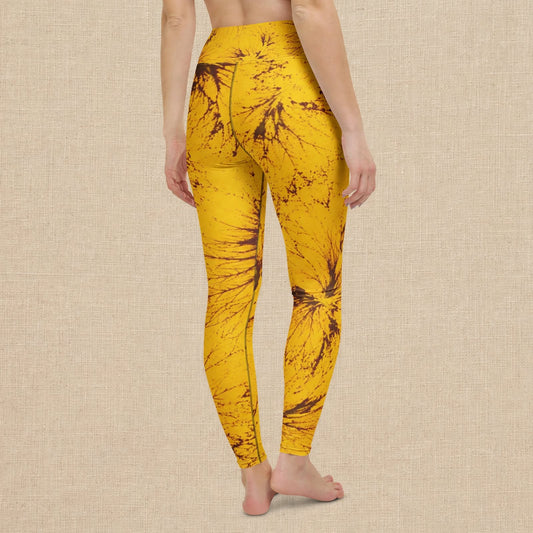 Model wearing yellow Sorbet Honeybee leggings against a beige backdrop.