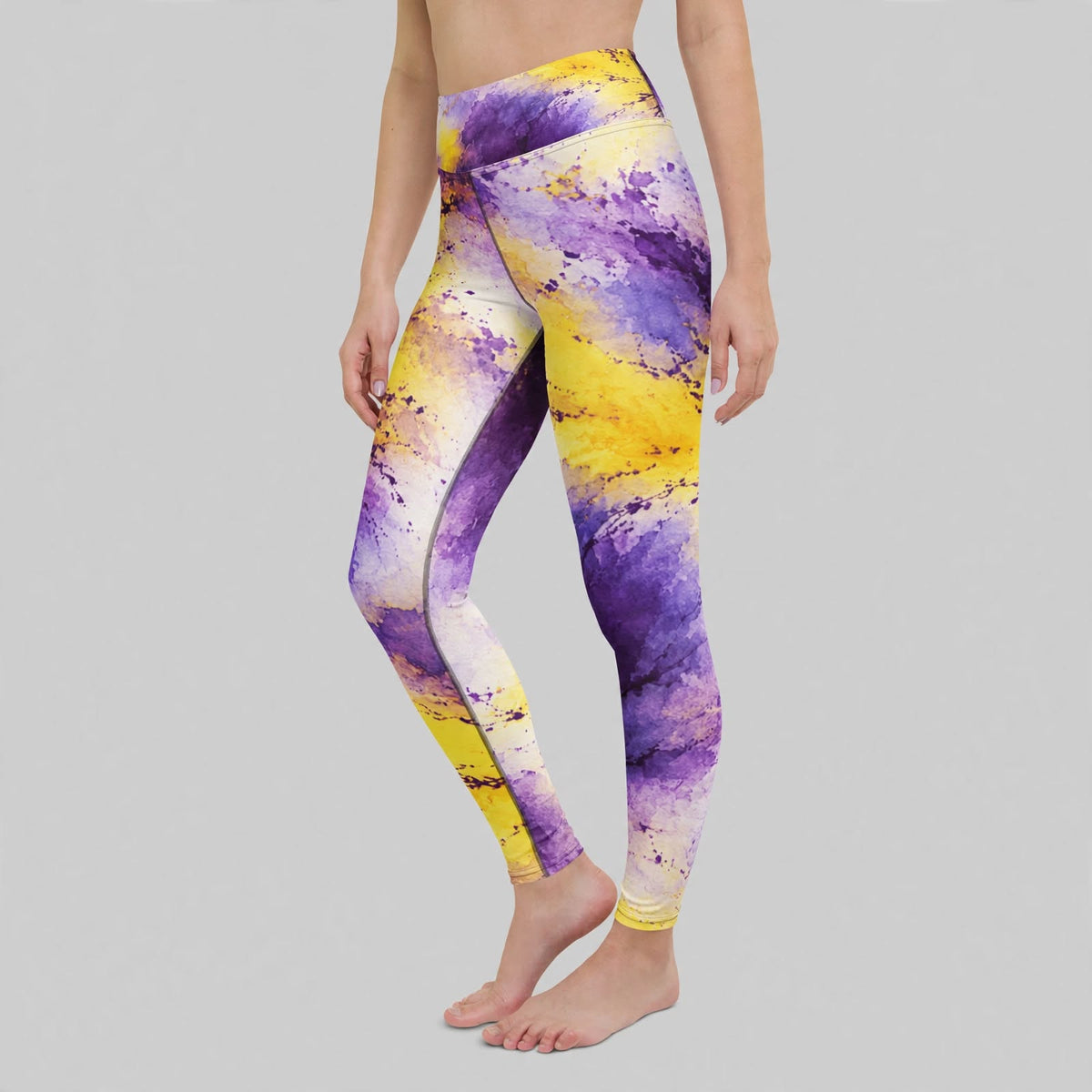 Woman wearing Sorbet Midnight Glow Viola print yoga leggings, purple and yellow print detail