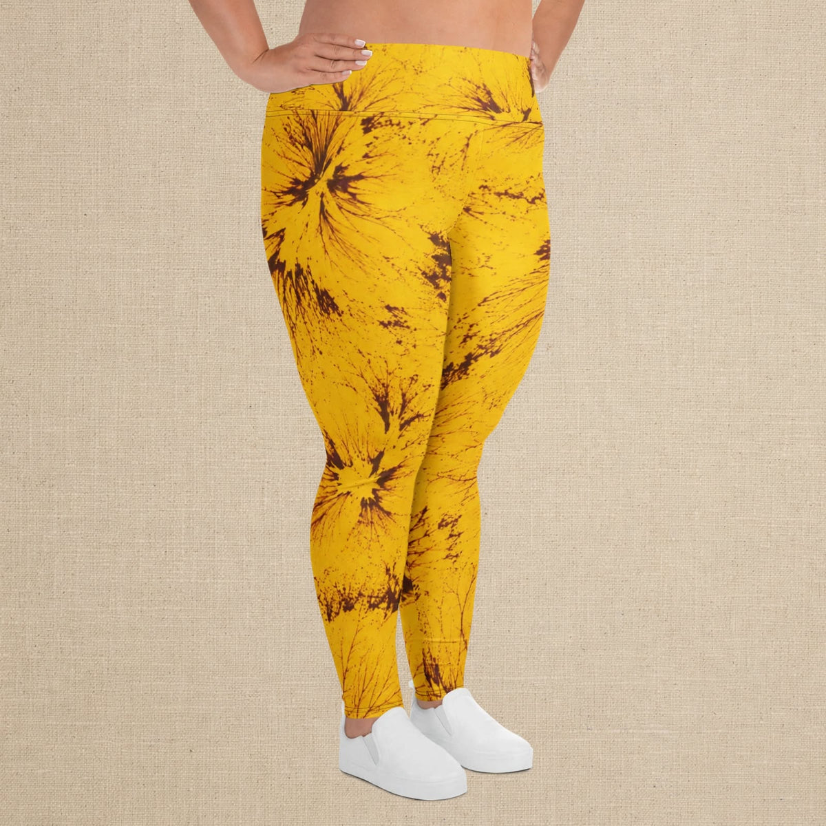 Plus size leggings in the Sorbet Honeybee print, studio product shot with linen backdrop.