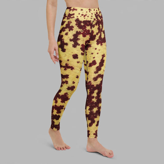 Leggings in the Godefroyae Orchid (cream and burgundy) print, studio product shot.